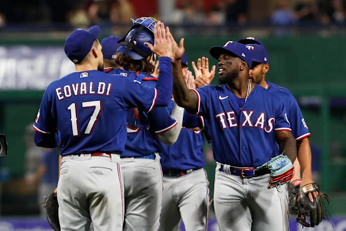 May 23, 2023; Pittsburgh, Pennsylvania, USA; Texas Rangers starting pitcher Nathan Eovaldi (17) and right fielder Adolis Garcia (right) celebrate after defeating the Pittsburgh Pirates at PNC Park. Mandatory Credit: Charles LeClaire-USA TODAY Sports